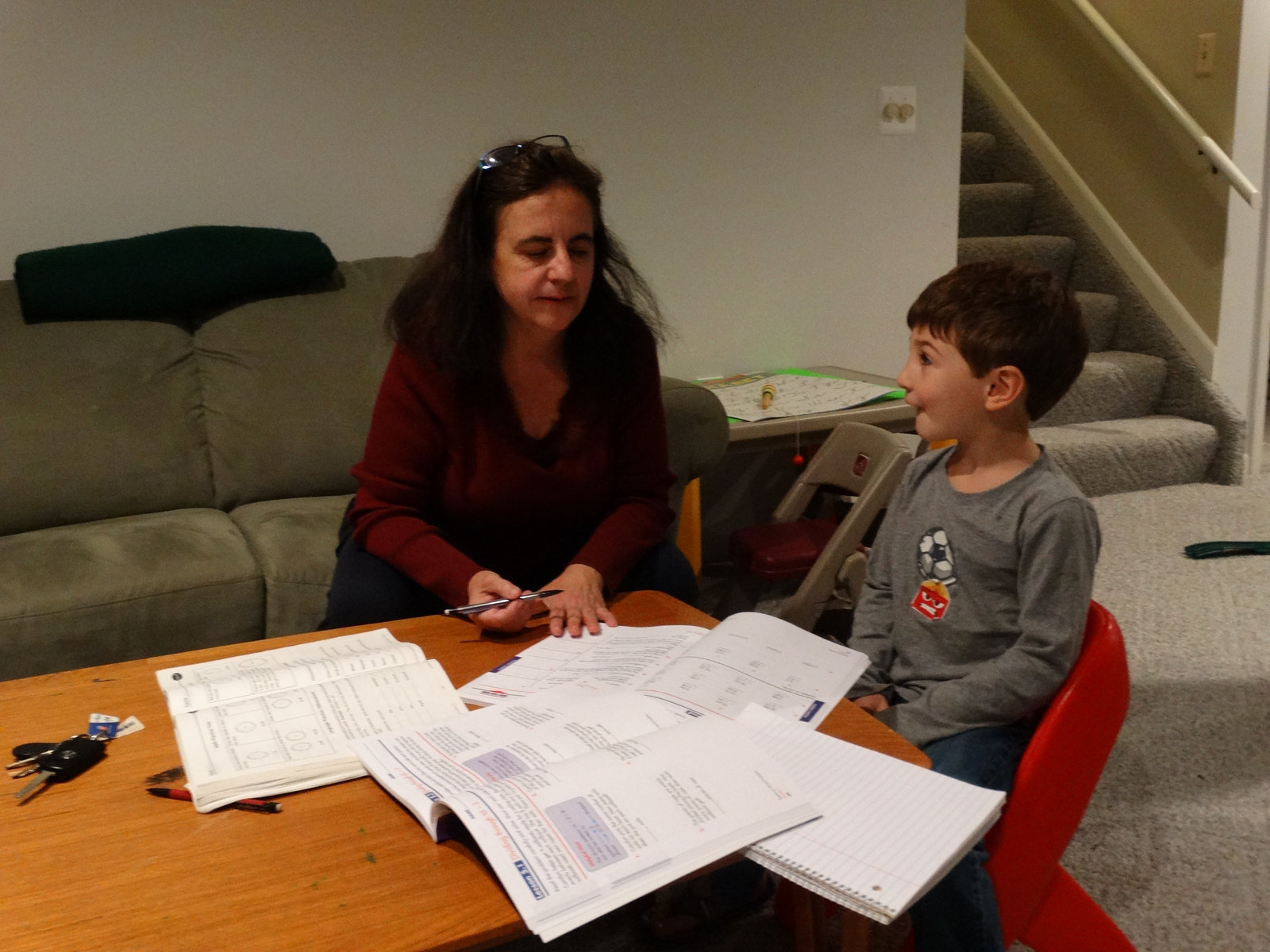 Anna tutoring a young student at home